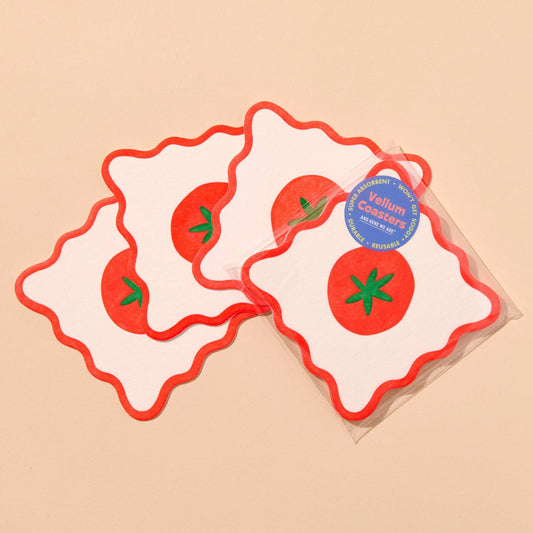 Set of coasters with a tomato design with a decorative label on a beige background