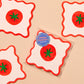 Vellum coasters with tomato design on a beige background