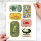 Collection of vintage-style fish can stickers held by a person on a light gray background