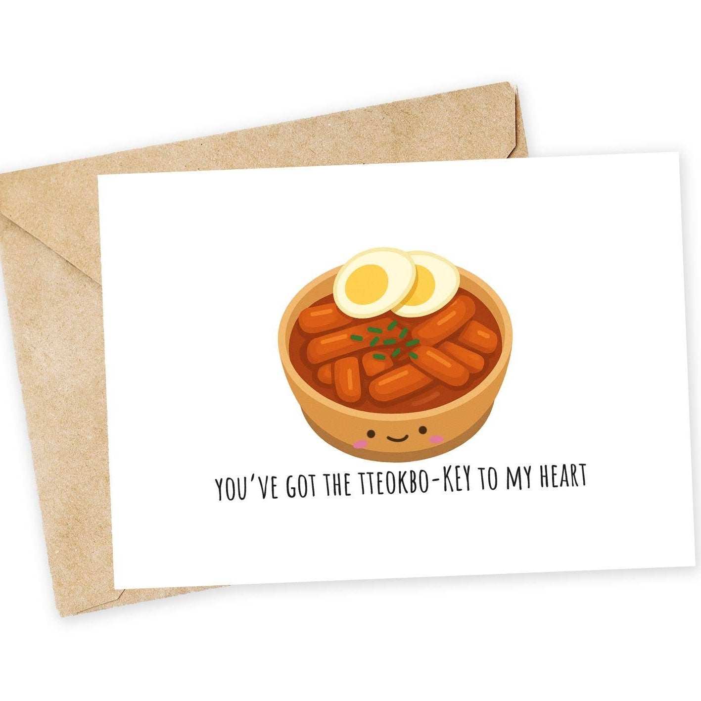Card with a cartoon bowl of korean spicy race cakes, or tteokbokki, with envelope on a white background. Text says "You've got the tteokbo-key to my heart" 