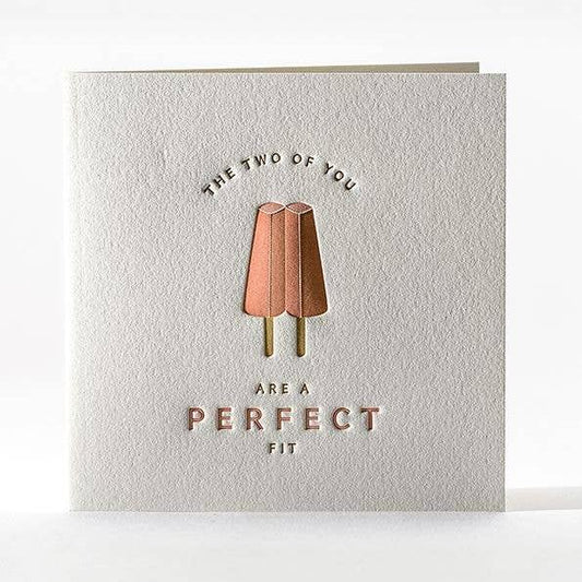 Greeting card with twin strawberry popsicles and text that reads "The two of you are a perfect fit" 