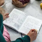 Recipe book being written in