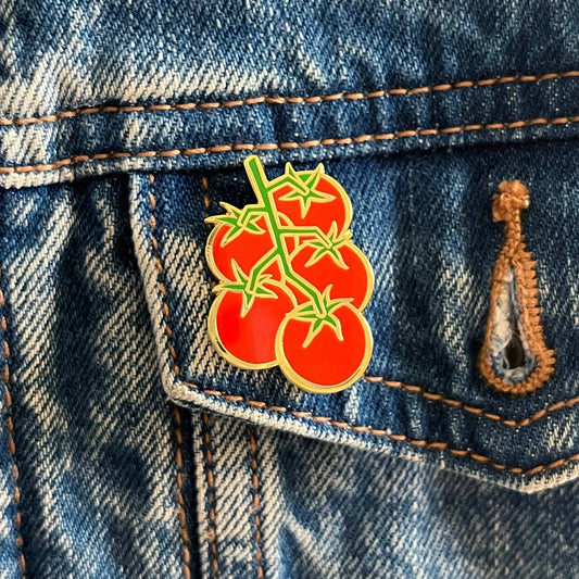 Tomato pin on a denim jacket