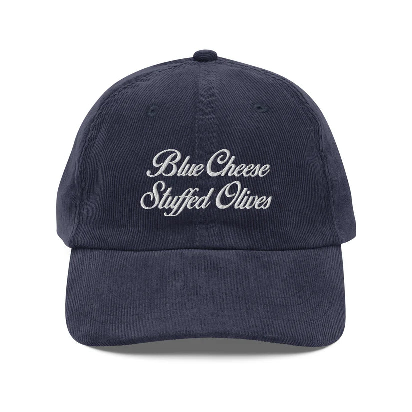 Navy blue cap with 'Blue Cheese Stuffed Olives' text on a white background