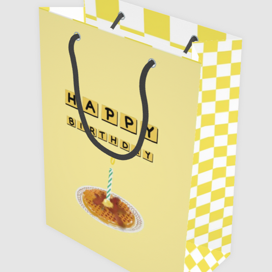Yellow and white checkered birthday gift bag with 'Happy Birthday' text and a waffle illustration.