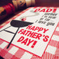Father's Day card with barbecue graphic and text, featuring a red and white design.