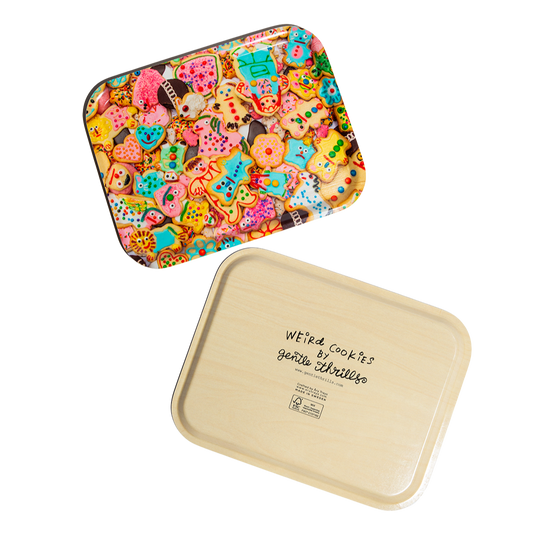 Colorful tray with a pattern of weird cookies on a white background