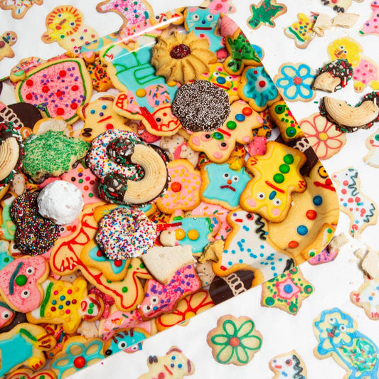 Assorted colorful cookies with various shapes and decorations on a white background