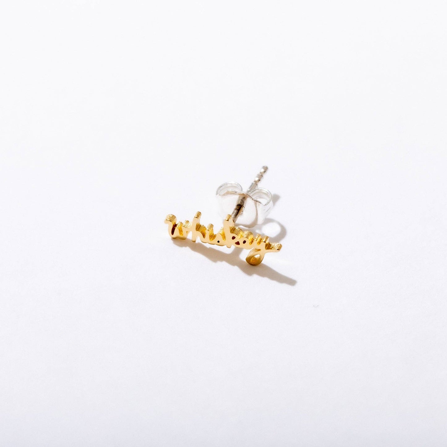 Single 14k gold plated stud earring -- reads "whiskey" in handwritten script