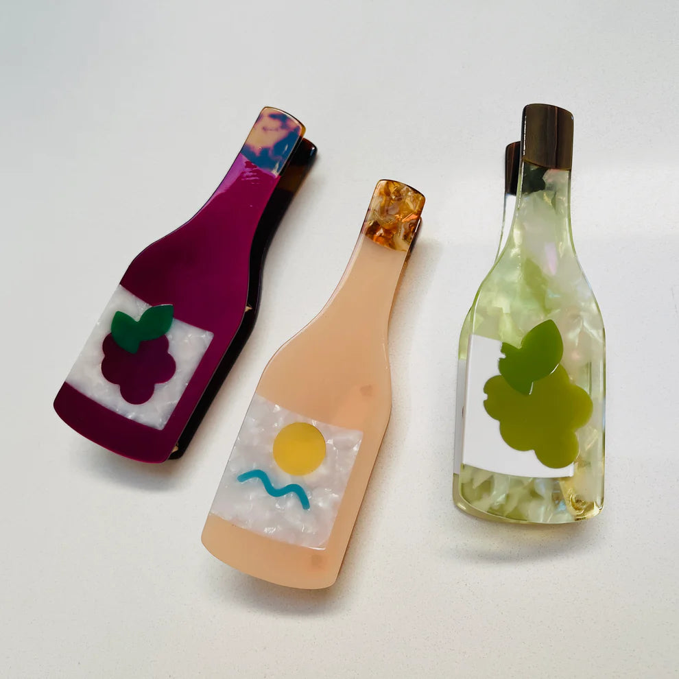 3 hair claws: red wine with grapes, rosé with abstract design, white wine wiht grapes