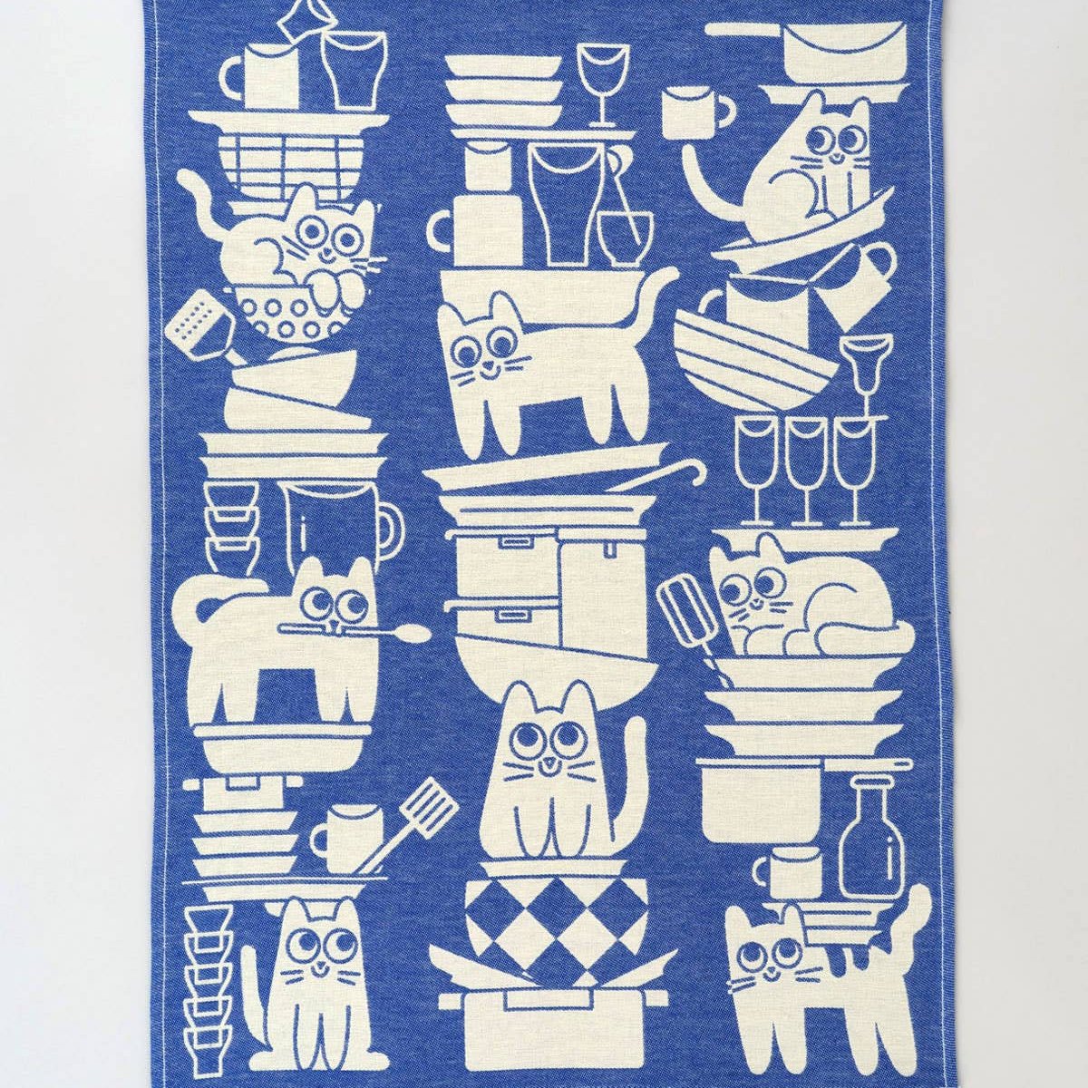 full design image of "kitchen cats" tea towel -- several cats playing in/with dishes