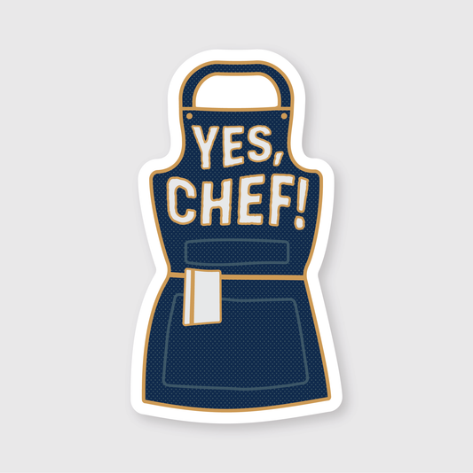 Navy blue apron with 'YES, CHEF!' text on a light gray background