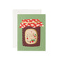Greeting card with a jar of jam design on a green background with text on label that says "the sweetest in the world. You're the Jam!"
