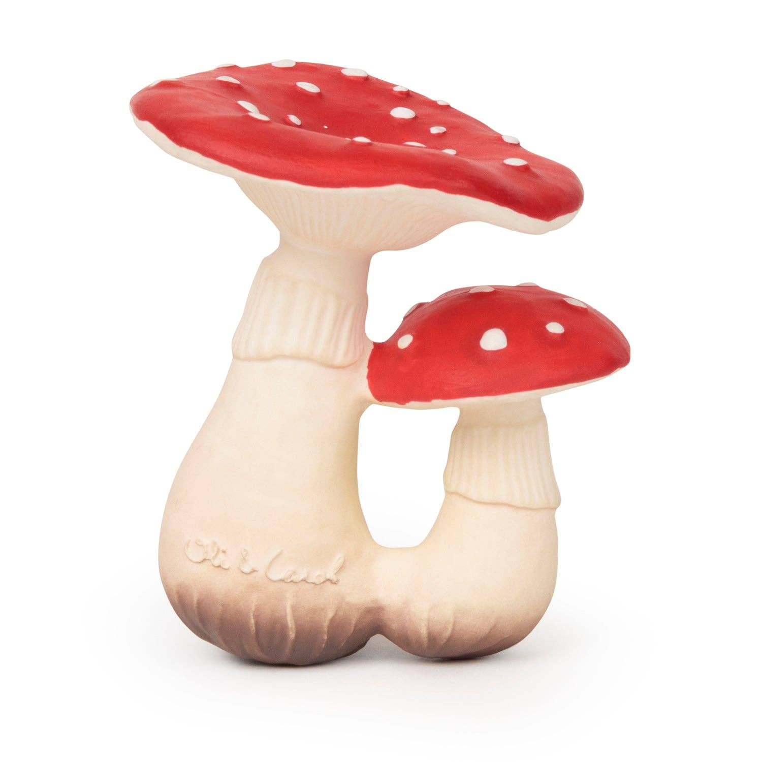 Photo of baby toy shaped like two woodland mushrooms with white stems and red tops that have small white spots.