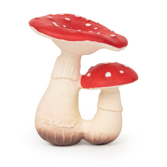 Photo of baby toy shaped like two woodland mushrooms with white stems and red tops that have small white spots.