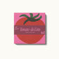 Pink post-it note pad with a red tomato illustration on it 