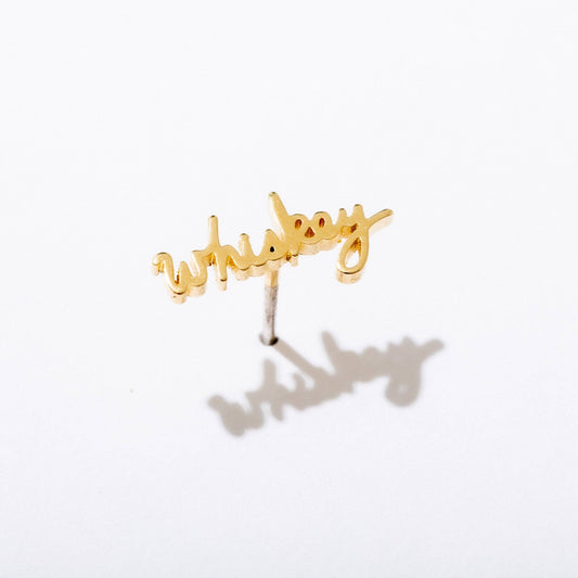Single 14k gold plated stud earring -- reads "whiskey" in handwritten script