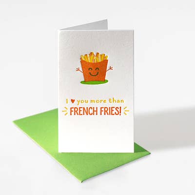 Mini enclosure card with french fries raising its arms. It  reads "I (heart) you more than French Fries!" with a green envelope.