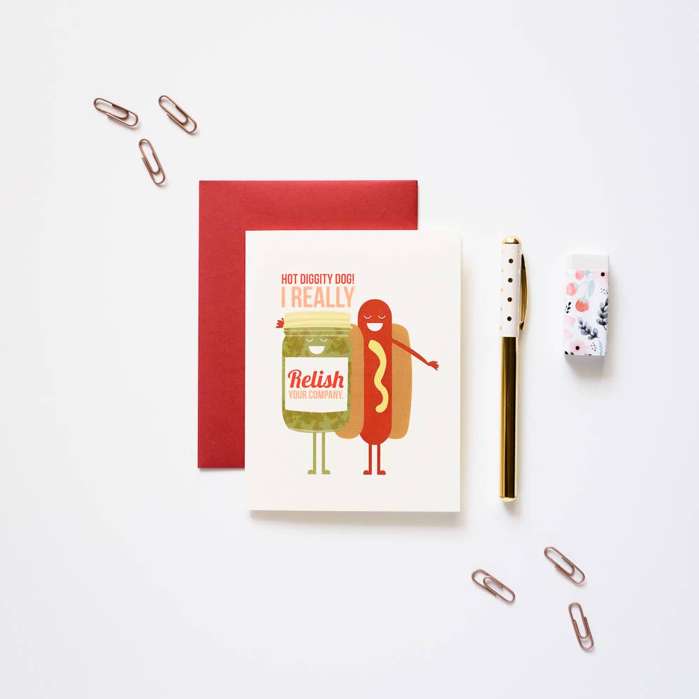 Hot dog-relish-greeting card -- Card reads "Hot diggity dog! I really relish your company" and has an image of a hot dog putting it's arm around a jar of relish. 