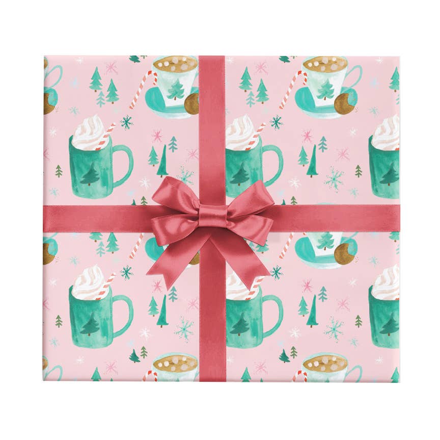 Christmas wrapping paper -- pink background with green cups of hot cocoa, candy cane and christmas trees 