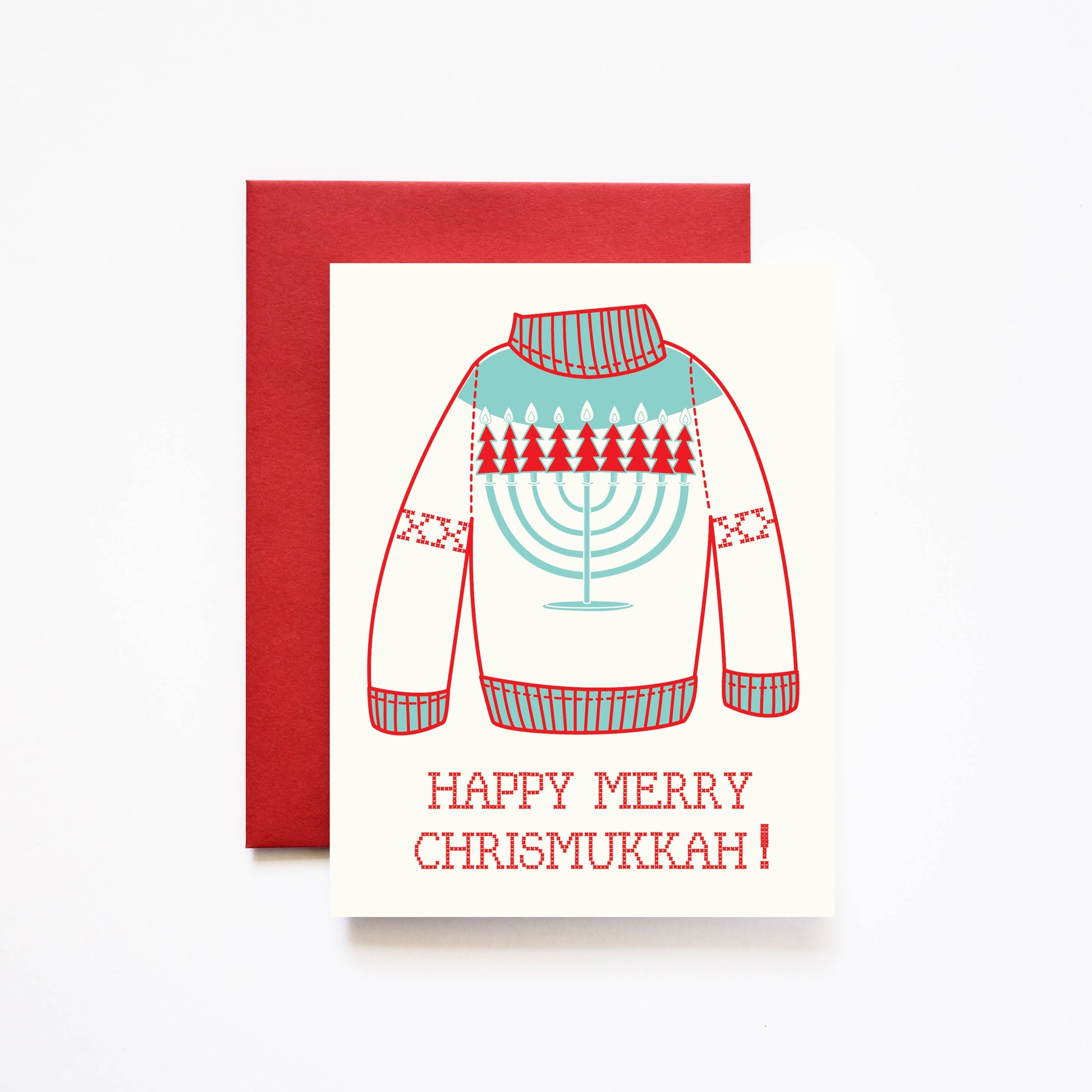 Holiday greeting card that reads "Happy Merry Chrismukkah!" underneath a knit sweater with a menorah on it 