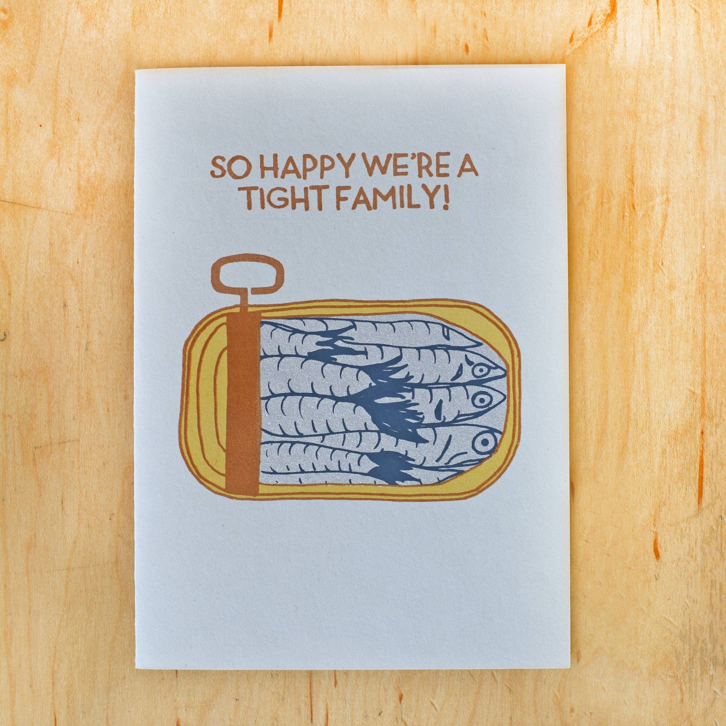 Greeting card with a tin of sardines on it that reads "So happy we're a tight family!" 