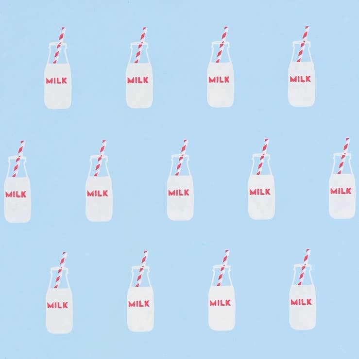 Milk bottle gift wrap with bottles 3/4 full with milk. The bottles say milk and there is a red and white straw sticking out of the bottle. Blue background.