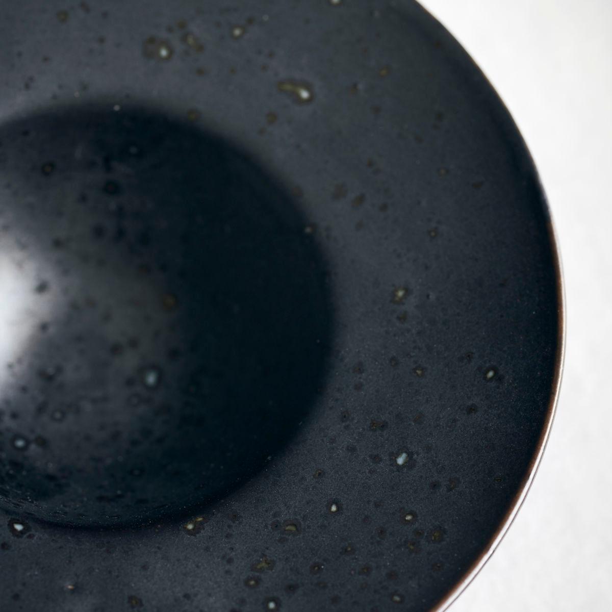 close-up of black egg cup/saucer 