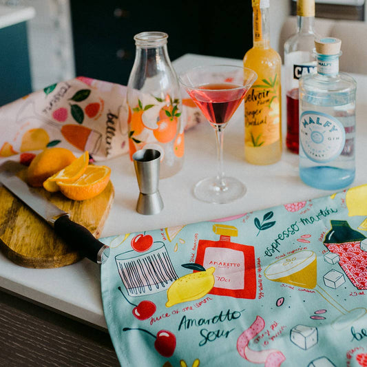 Cocktail Party tea towel or kitchen towel in Blue -- has images of ingredients for different cocktails 