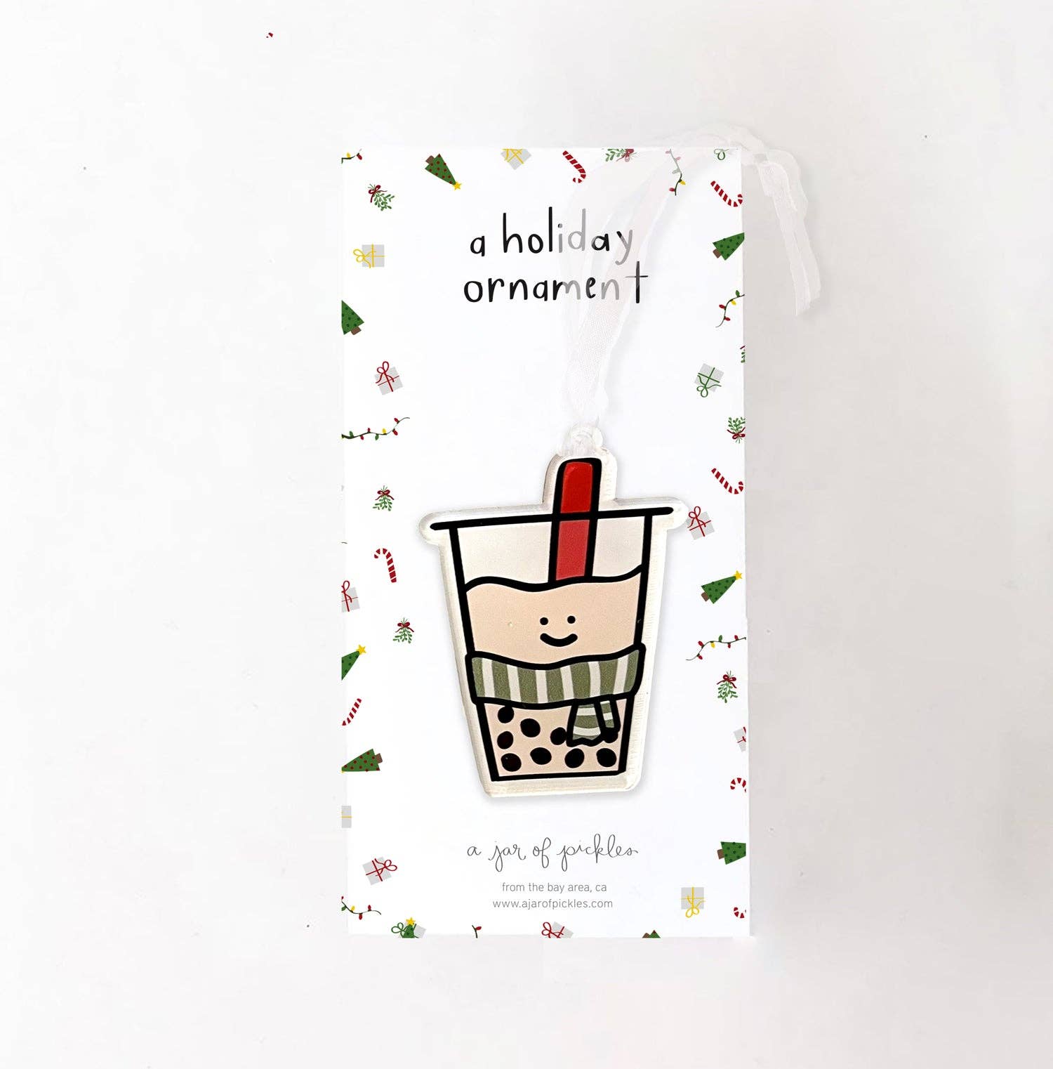 Clear, plastic, one-sided boba drink wearing a scarf ornament 