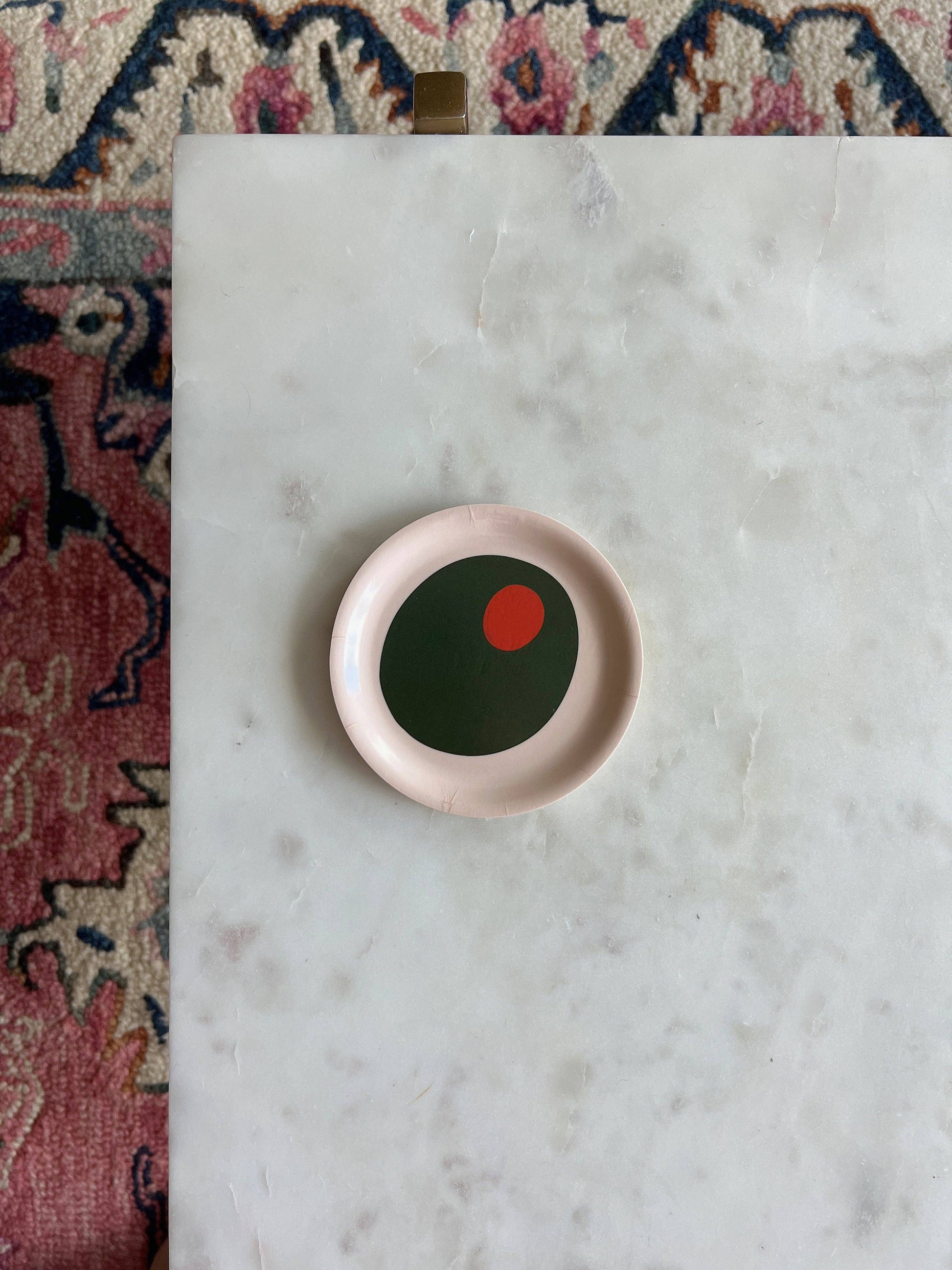 Small trinket dish with a pimento olive illlustration on it