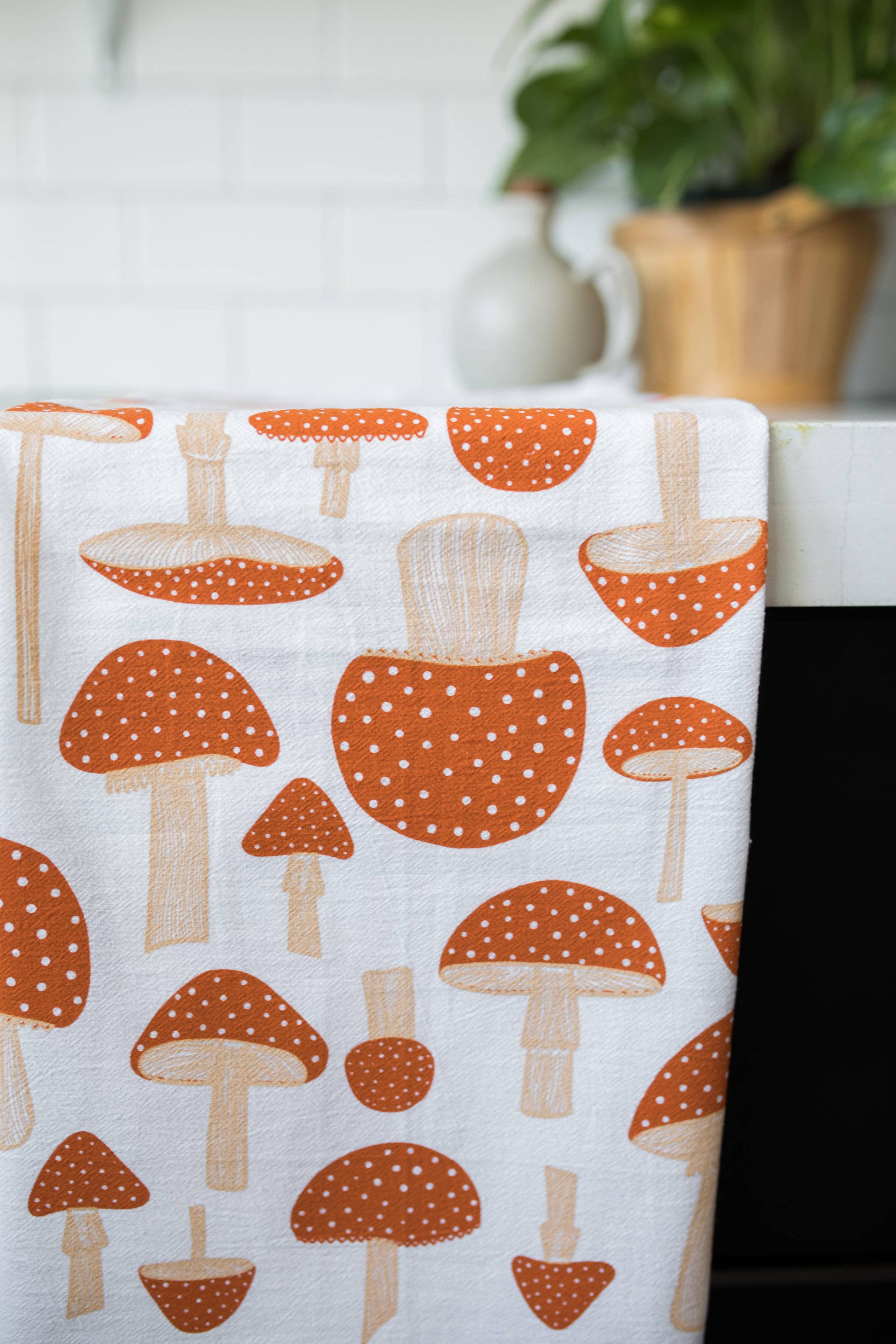 Tea towel with red capped mushrooms on it 