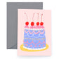 Mother's day card with a decorated cake adorned with cherries on it. Text on cake reads "Happy Mothers Day" 