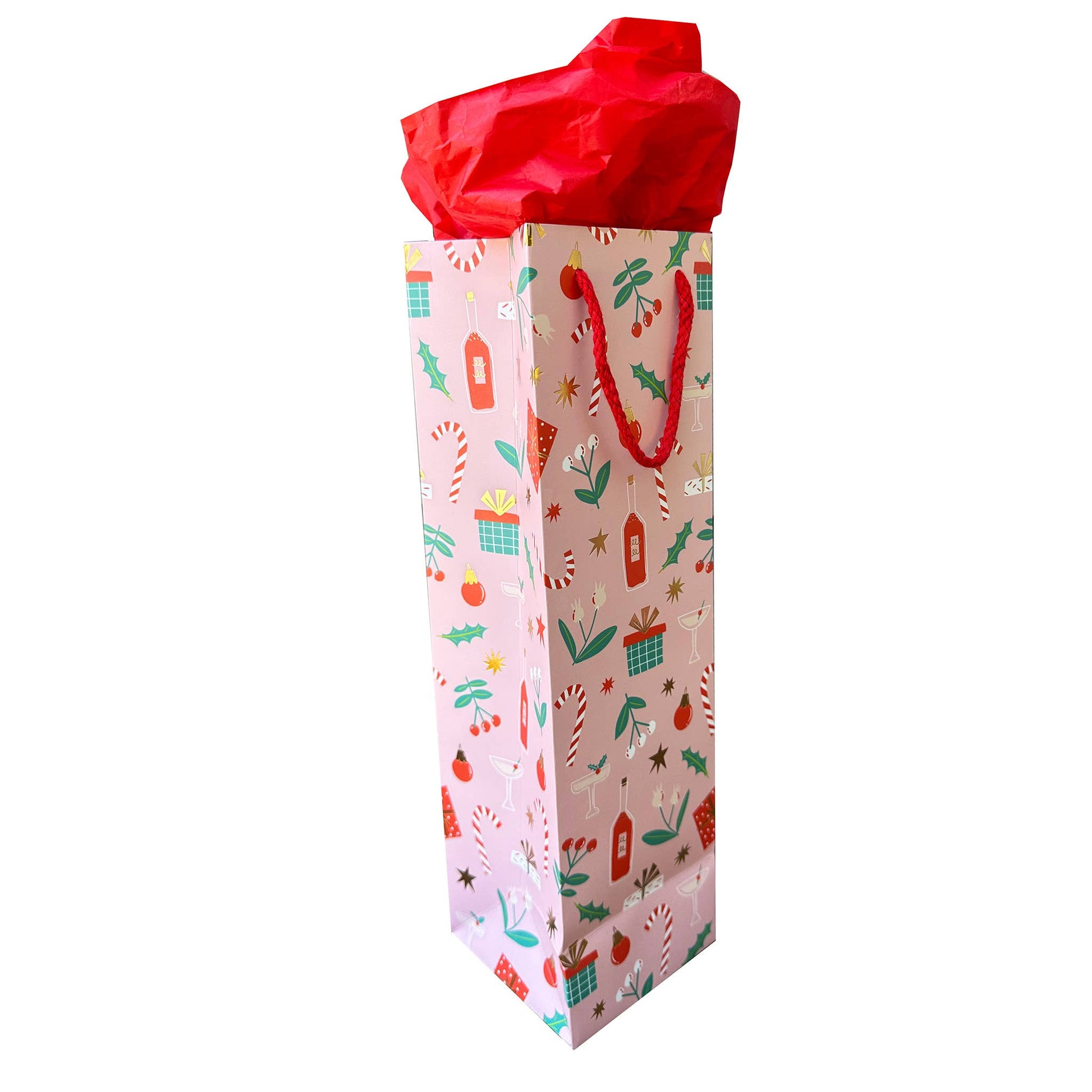 Holiday themed wine gift bag pink with candy canes, presents, ornaments, mistletoe, holly, champagne and wine on it with red cord handle 