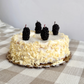 Four candles that look like blackberries on a cake