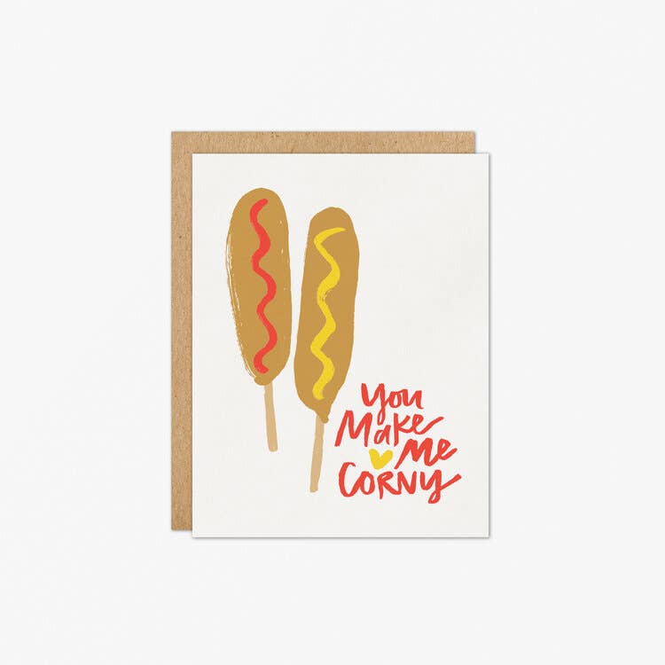 Corndog greeting card -- image is two corndogs, one with ketchup the other mustard, and it reads "You make me corny" 