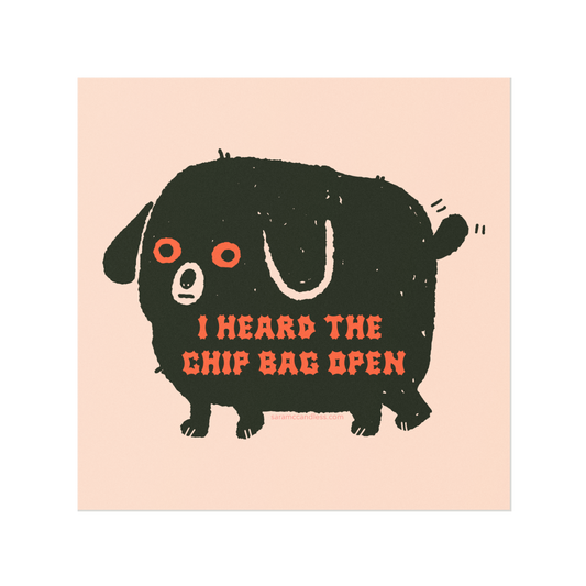 Art print with image of a black dog with red eyes and red text that reads "I heard the chip bag open" 