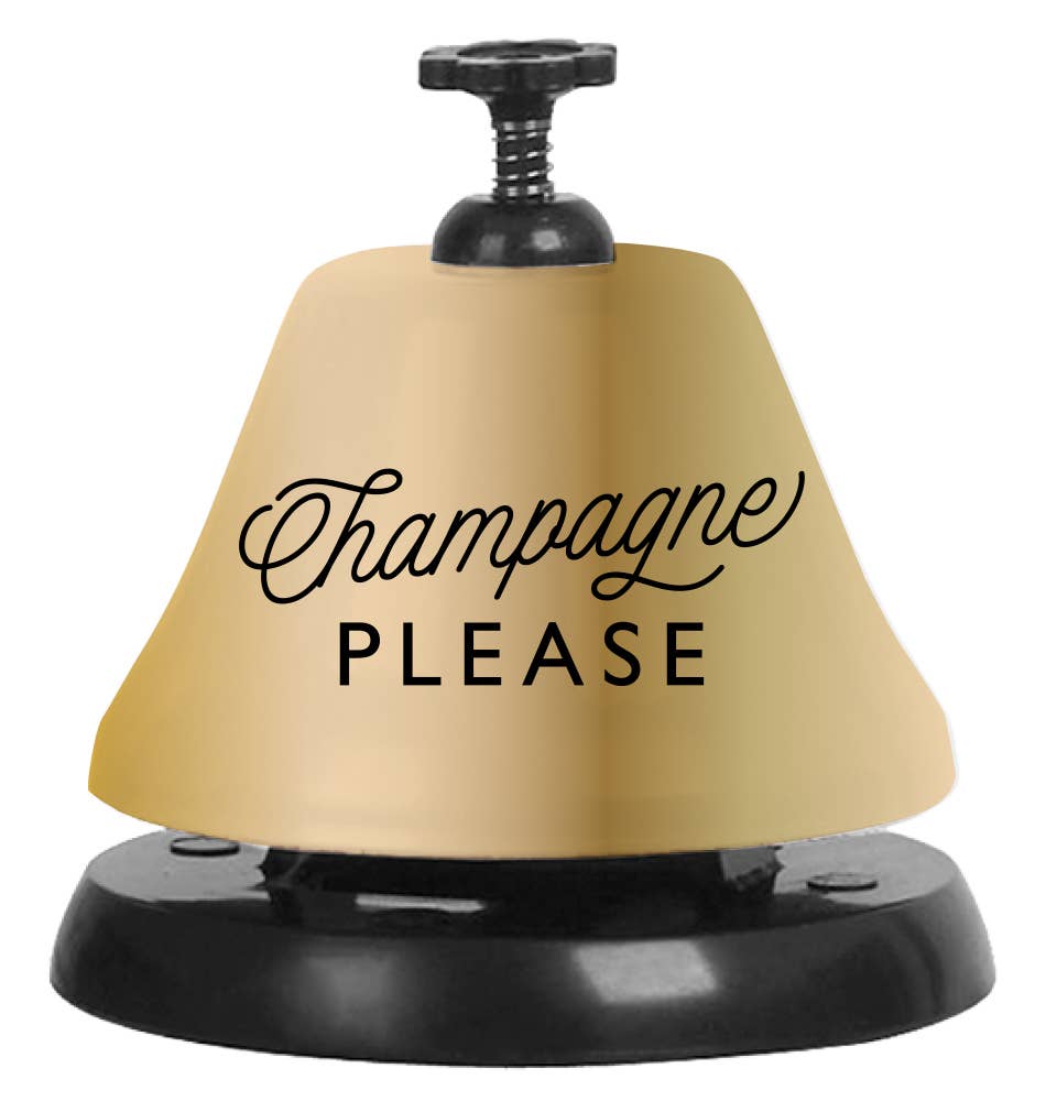 gold and black call bell that reads "champagne please" 
