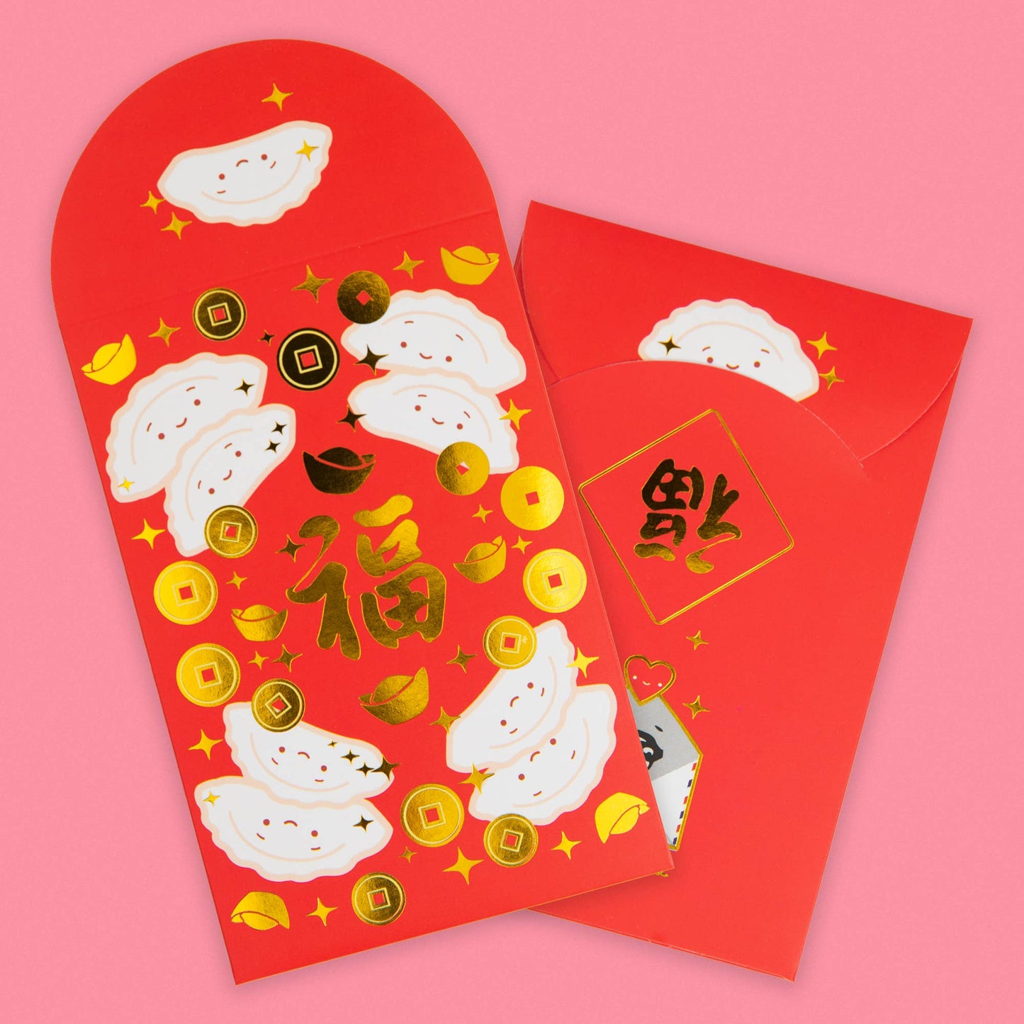 Gold foiled red envelopes with happy dumplings on them 