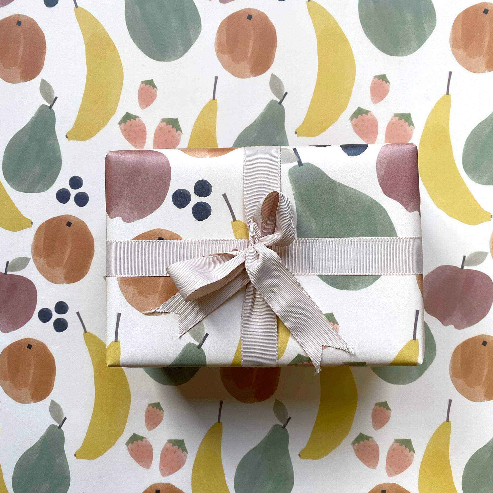 Sheet of wrapping paper with watercolor style fruit illustrations