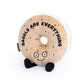 Everything bagel plush toy that reads "bagels are everything" 