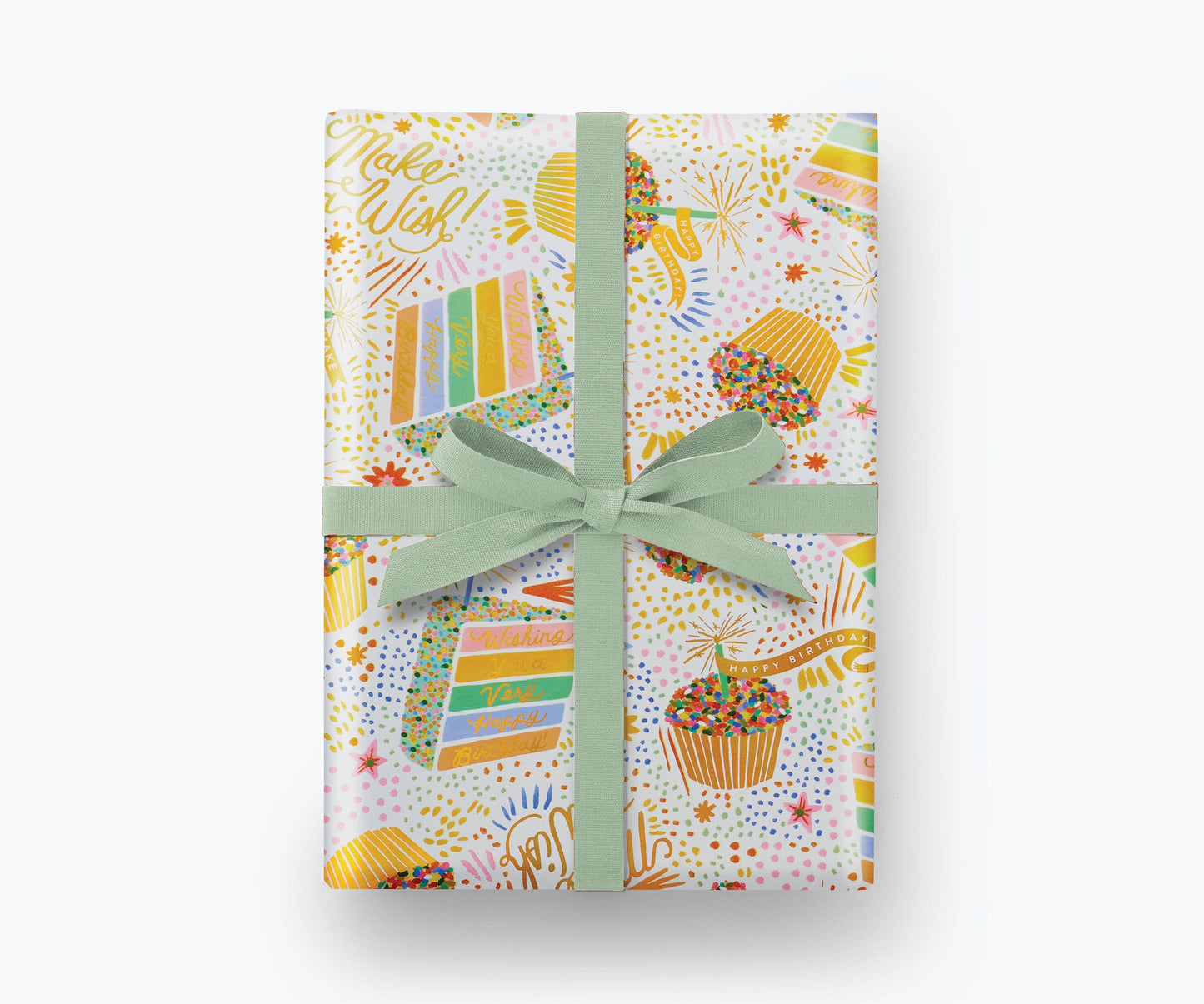 Birthday Cake Wrapping Paper shown with a blue bow. Illustration on wrapping paper features cupcakes and slices of colorful layer cake with lots of sprinkles. Multiple areas of text read "Make a WIsh!" and "Wishing you a very Happy Birthday" in gold script.