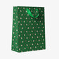 Green holiday gift bag with boba and candy canes all over it 
