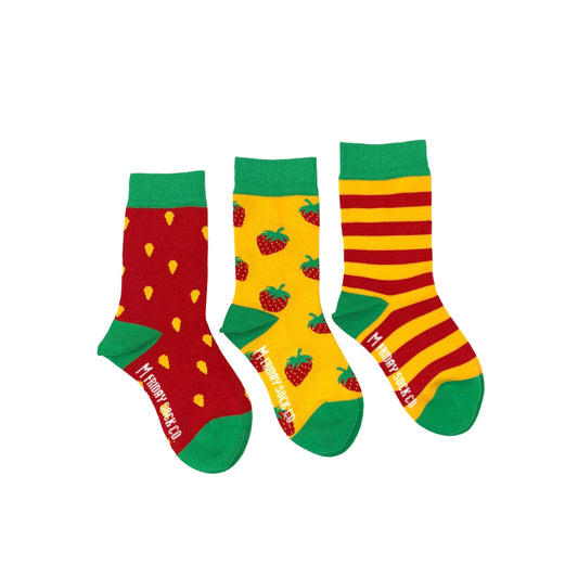3 pair of mismatched kids socks -- one is red with yellow spots for the strawberry seeds, one is yellow with whole strawberries on it and the other is yellow and red stripes 