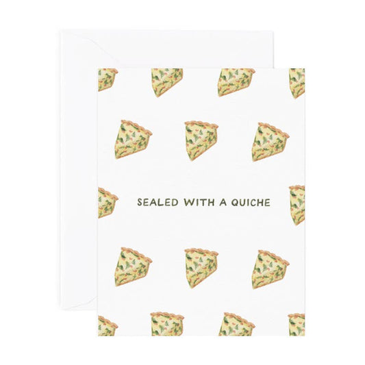 Love greeting card that reads "Sealed With A Quiche" and designed with slices of quiche 