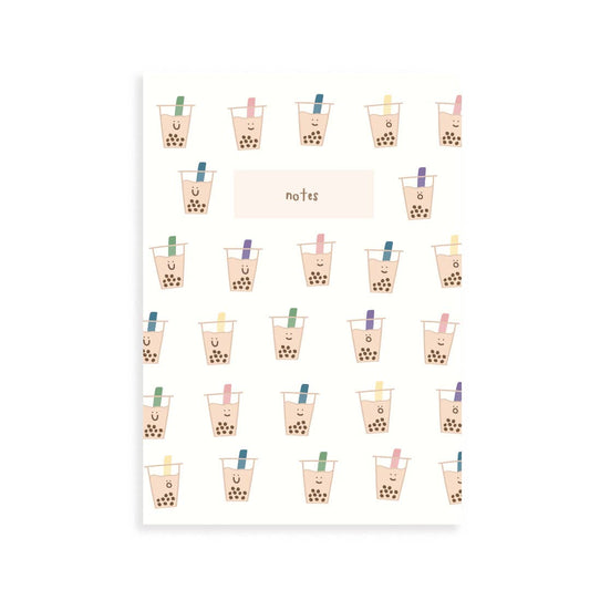 Front of a notebook with smiley faced boba cups as the design. In the center there is a light pink solid box that reads "notes" 