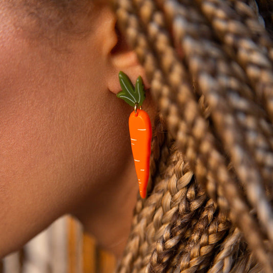 carrot earrings worn on model 