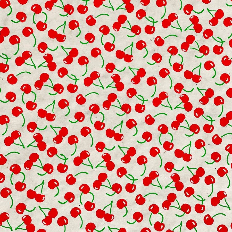 Sheet of gift wrap designed with red cherries with green stems all over