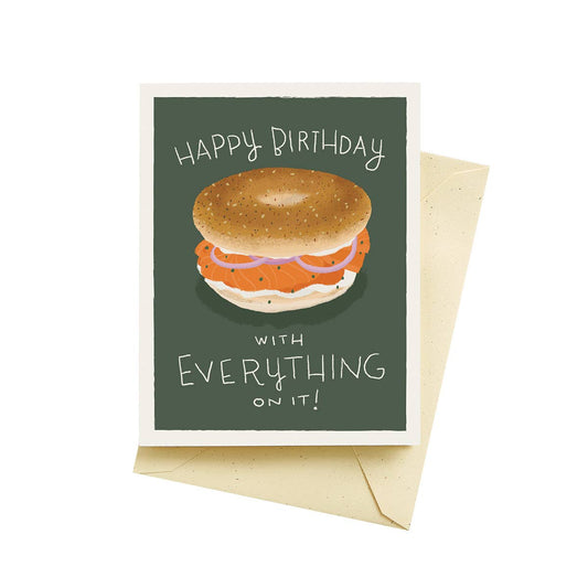 Bagel birthday card that reads "Happy Birthday with Everything on it!" and has an image of an everything bagel with lox