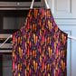 Adult size purple apron with rainbow carrots all over 